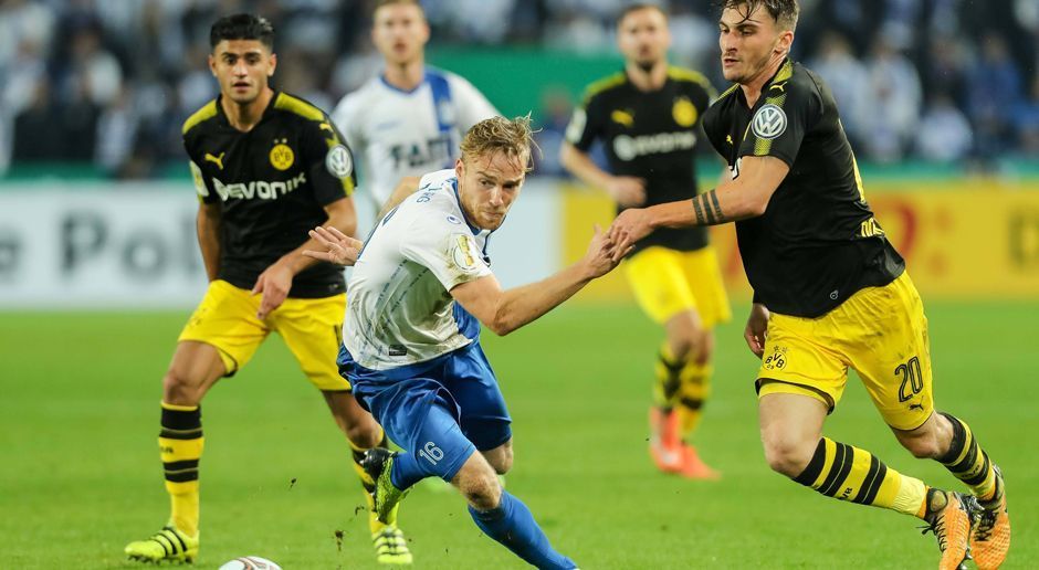 
                <strong>Der BVB gegen Magdeburg in der Einzelkritik</strong><br>
                Borussia Dortmund kommt mit einem deutlichen 5:0-Auswärtssieg beim 1. FC Magdeburg zurück in die Erfolgsspur. Vor allem der Aubameyang-Ersatz glänzt. Die BVB-Kicker in der Einzelkritik.
              