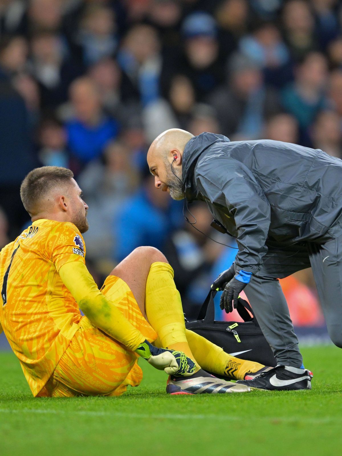 23rd November 2024; Etihad Stadium, Manchester, England; Premier League Football, Manchester City versus Tottenham Hotspur; Guglielmo Vicario of Tottenham Hotspur needs medical help after a tussle ...