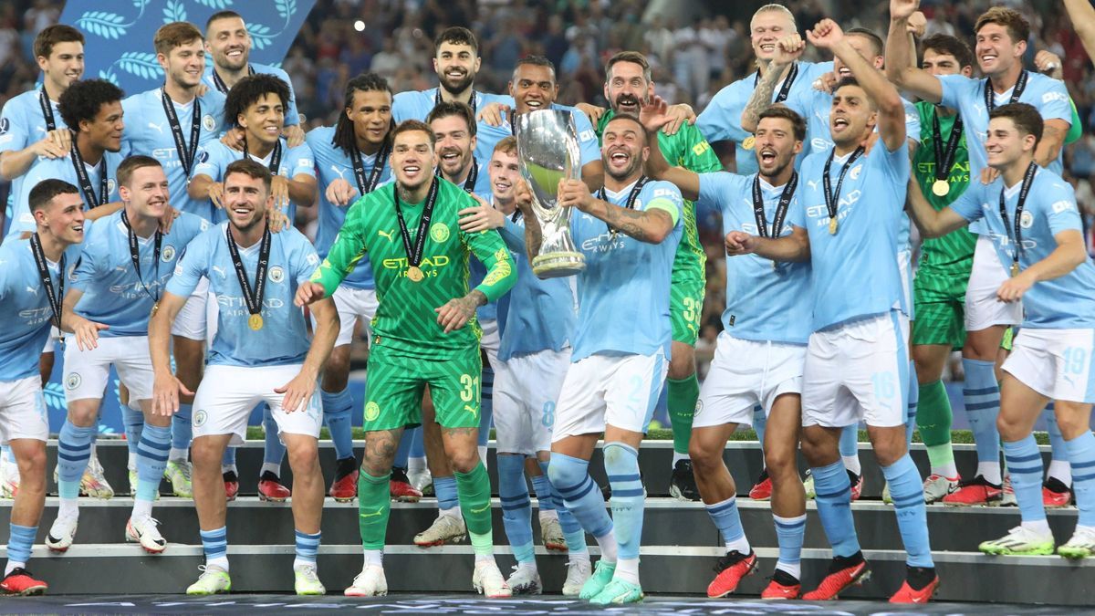 Manchester City vs Sevilla FC Manchester City players celebrate during the trophy ceremony of the UEFA Super Cup soccer match between Manchester City and Sevilla FC in Piraeus, Greece, 16 August 20...