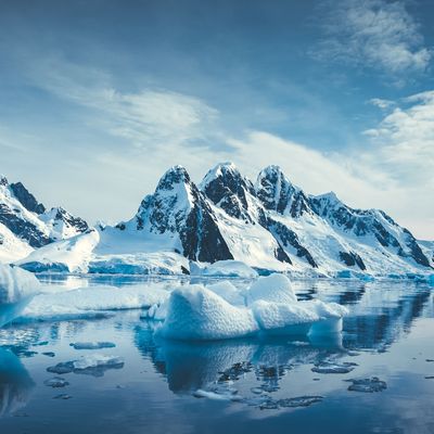 Blue Ice covered mountains in south polar ocean