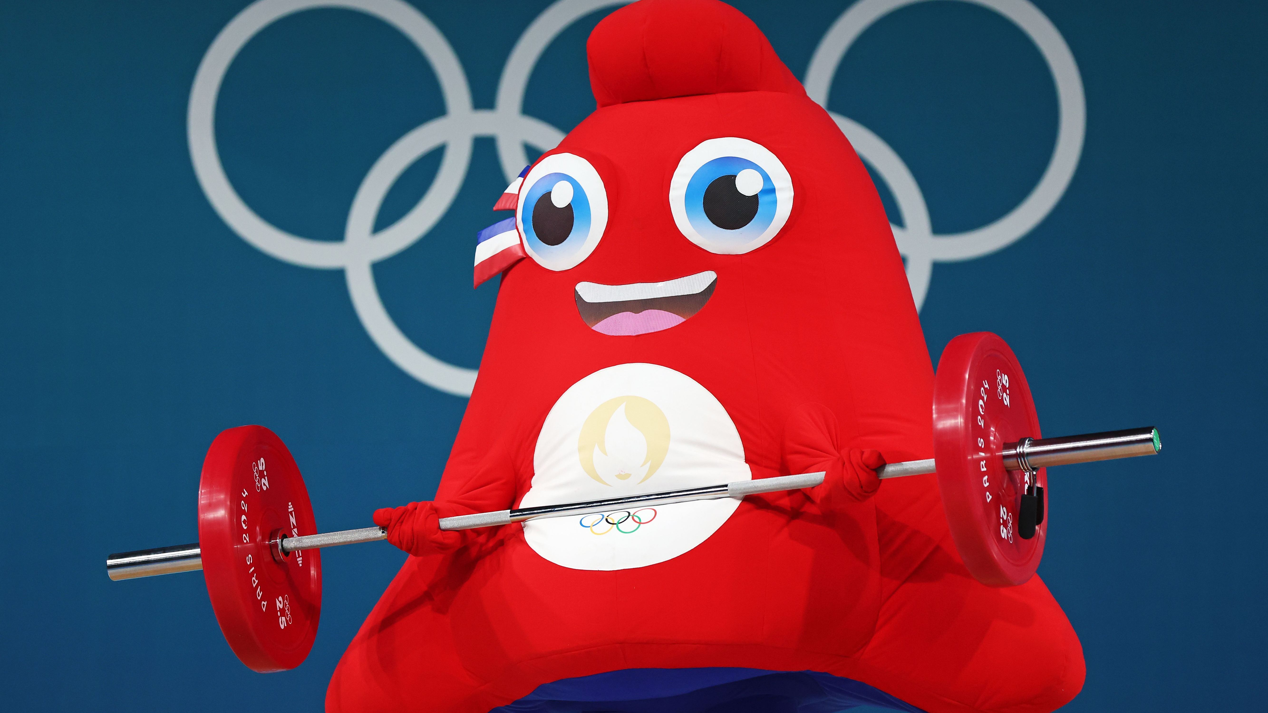 <strong>Olympia 2024: Die besten Bilder des 13. Tages</strong><br>Das Olympische Maskottchen Phryge zeigt beim Gewichtheben, was es drauf hat.