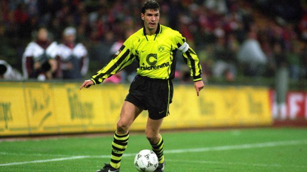 
                <strong>Michael Zorc (Borussia Dortmund)</strong><br>
                Michael Zorc (Borussia Dortmund): 571 Spiele, 195 Tore und acht Titel - Michael Zorc lebt für Borussia Dortmund. 20 Jahre lang war der heute 53-Jährige als Spieler für die Borussia aktiv und konnte 1997 mit dem Champions-League-Titel den größten Erfolg seiner Karriere feiern. 1998 beendete der legendäre Achter seine Karriere und wurde Sportdirektor bei Schwarz-Gelb.  
              