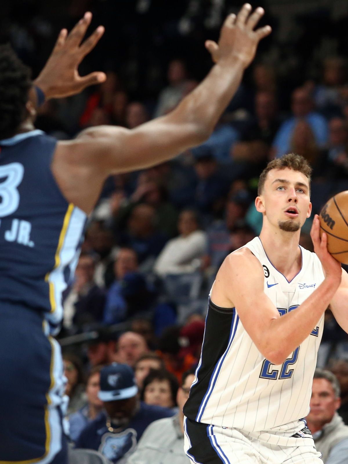NBA, Basketball Herren, USA Orlando Magic at Memphis Grizzlies Mar 28, 2023; Memphis, Tennessee, USA; Orlando Magic forward Franz Wagner (22) shoots a 3-pointer during the first half against the Me...