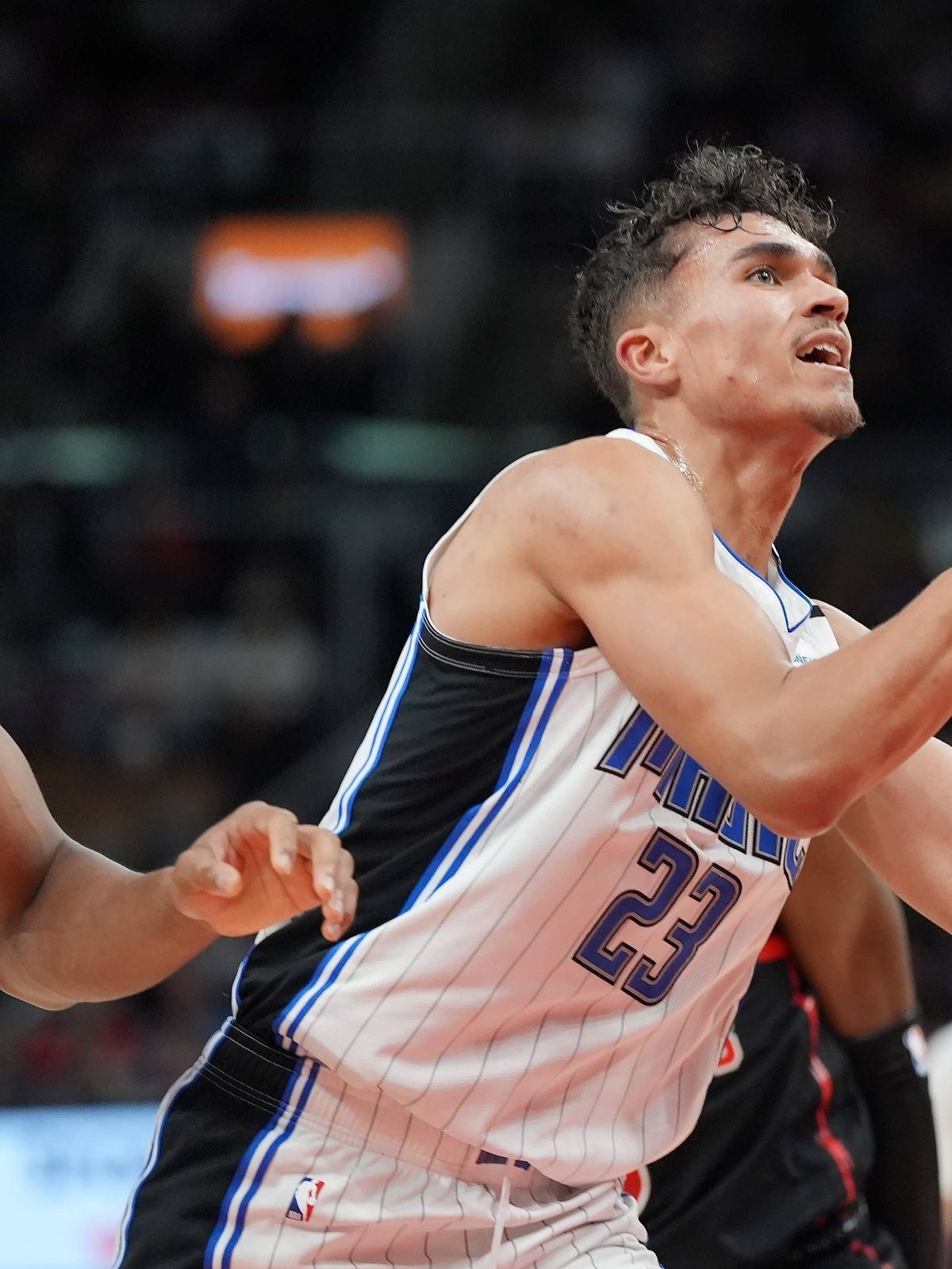 January 3, 2025, Toronto, On, Canada: Orlando Magic forward Tristan da Silva (23) drives to the net as Toronto Raptors forward Scottie Barnes (4) defends during second half NBA, Basketball Herren, ...