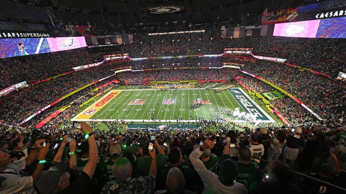 The Philadelphia Eagles run onto the field before the start of Super Bowl LIX between the Philadelphia Eagles and the Kansas City Chiefs at Caesars Superdome in New Orleans on Sunday, February 9, 2...