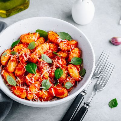 Traditional Italian potato Gnocchi with tomato sauce, parmesan cheese and fresh basil
