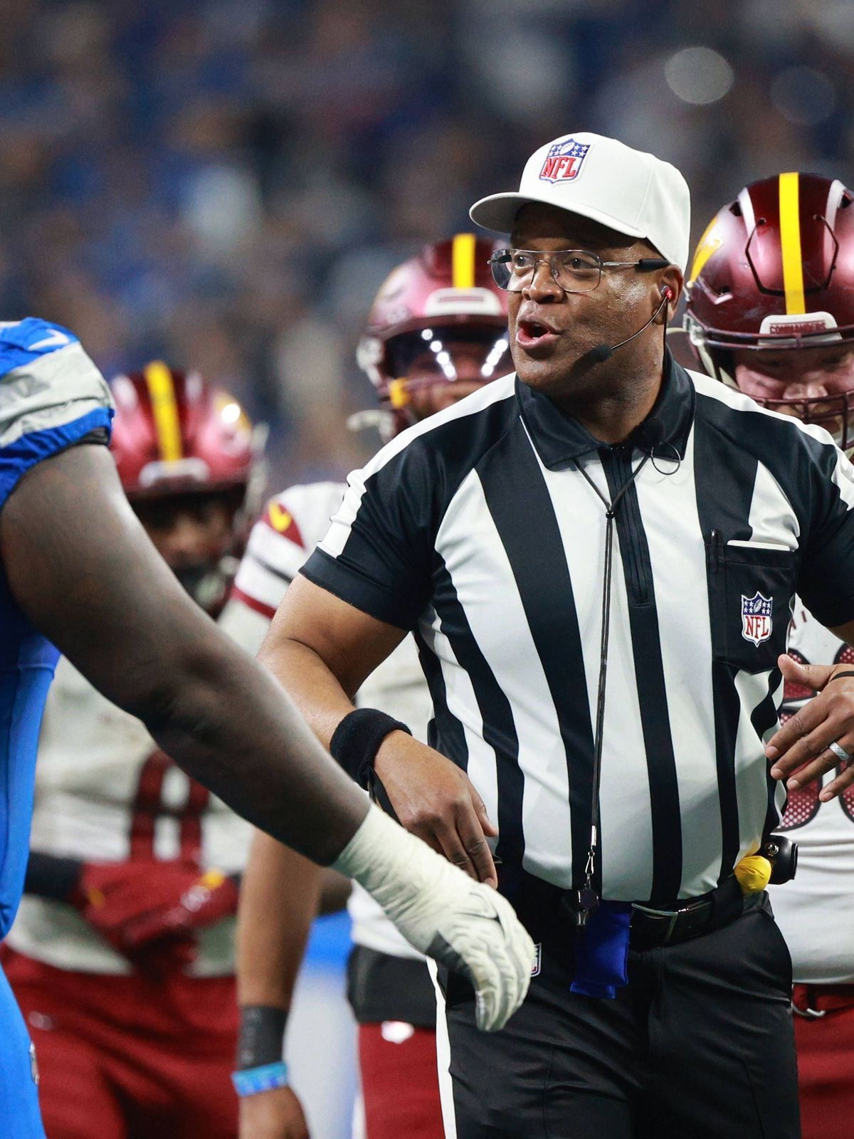 Washington Commanders vs Detroit Lions DETROIT,MICHIGAN-January 18: Referee Ron Torbert talks to players during the second half of an NFL, American Football Herren, USA Divisional Playoff game betw...