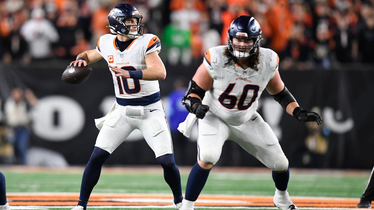 CINCINNATI, OH - DECEMBER 28: Denver Broncos Quarterback Bo Nix (10) passes as Denver Broncos Center Luke Wattenberg (60) blocks during the NFL, American Football Herren, USA football game between ...