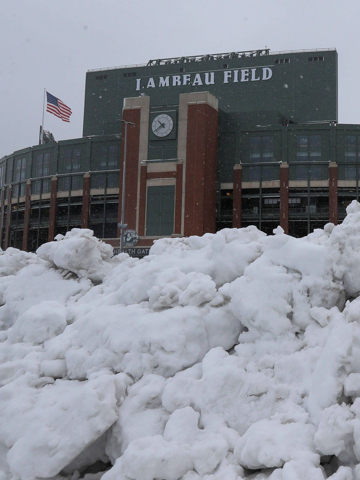 Syndication: Green Bay Press-Gazette Snow is seen piled up on Wednesday, April 3, 2024, at Lambeau Field in Green Bay, Wis. A winter storm system that began on Tuesday is expected to drop 8-12 inch...