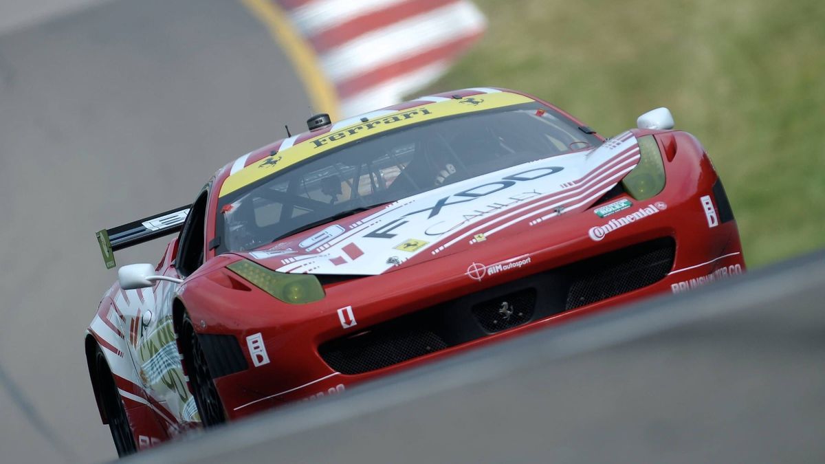 June 29, 2013 - Watkins Glen, New York, U.S - The GT GX Class AIM Autosport Team FXDD with Ferrari Ferrari 458 driven by EMIL ASSENTATO and LEH KEEN and ANTHONY LAZZARO (69) breaks over the hill ex...