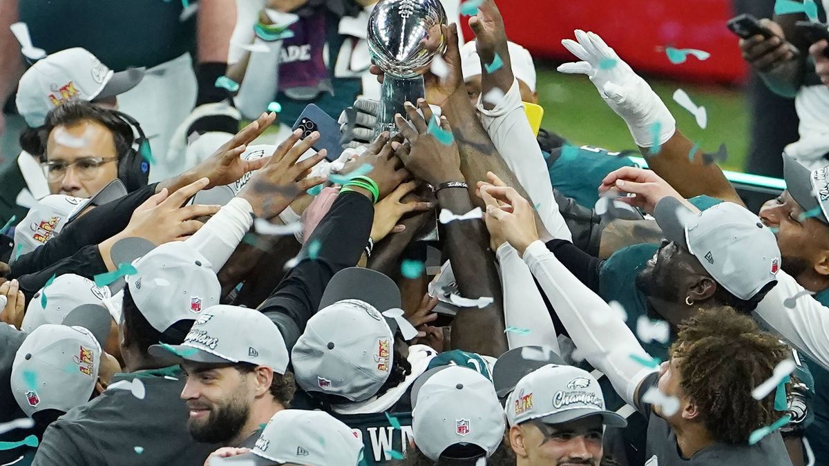 Philadelphia Eagles players hold the Vince Lombardy Trophy after defeating the Kansas City Chiefs 40-22 in Super Bowl LIX at Caesars Superdome in New Orleans on Sunday, February 9, 2025. PUBLICATIO...