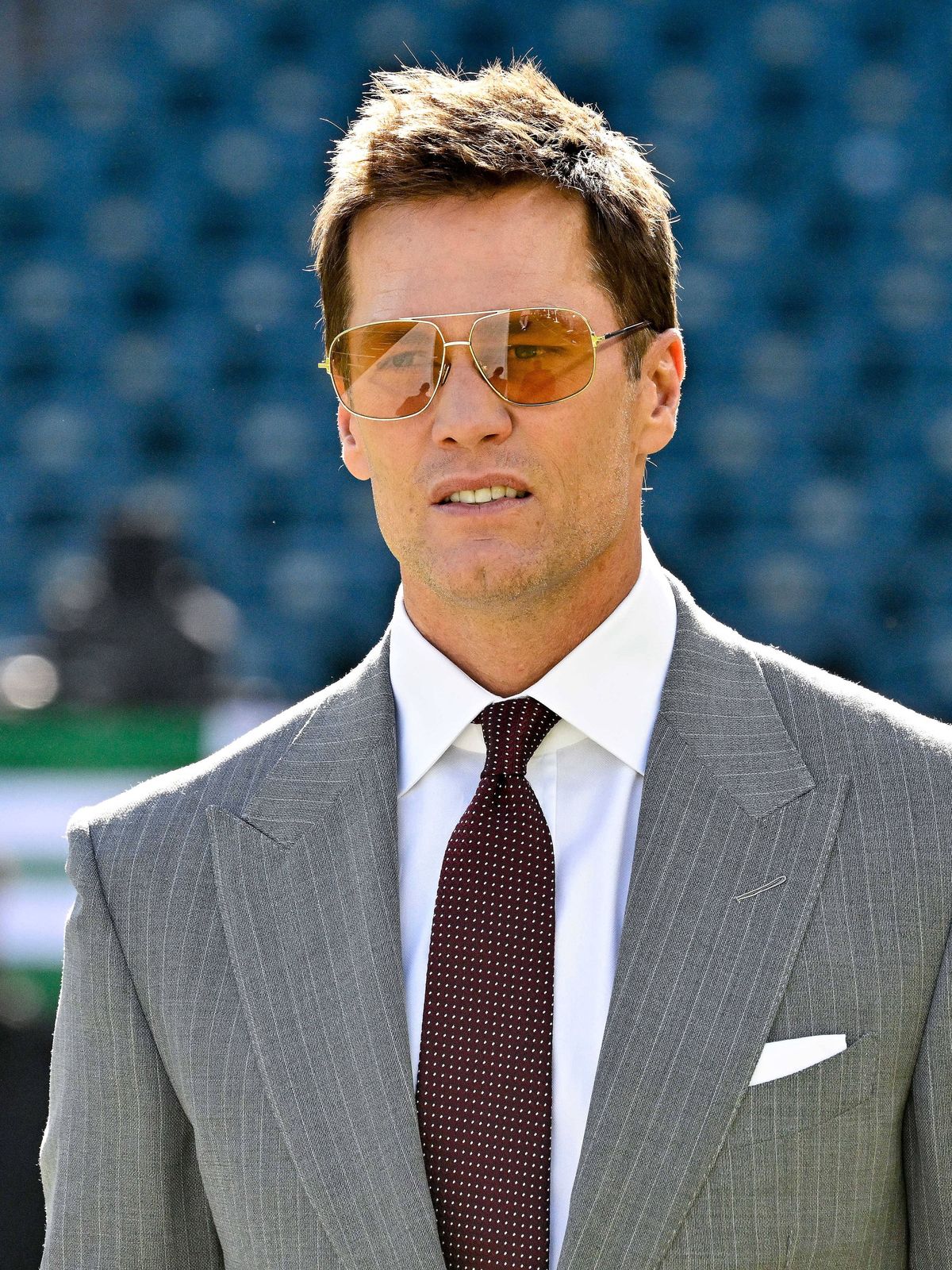 October 26, 2025, Philadelphia, Pennsylvania, USA; Former NFL, American Football Herren, USA quarterback and current Fox Sports commentator Tom Brady walks on the field before a game between the Ph...