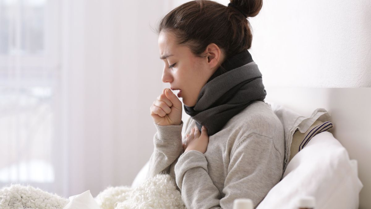 Young ill woman in bed at home