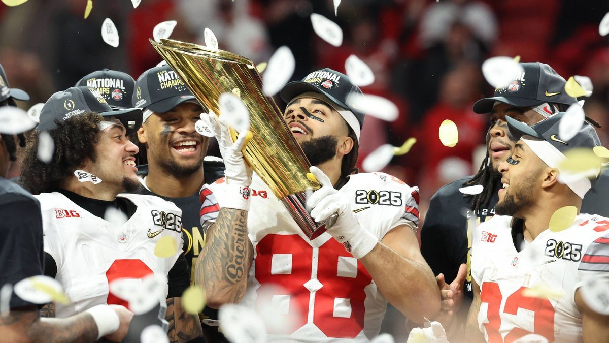 Ohio State tight end Gee Scott Jr. (88) holds the trophy after the Buckeyes defeated Notre Dame 34-23 to win the 2025 College Football Playoff National Championship at Mercedes-Benz Stadium in Atla...