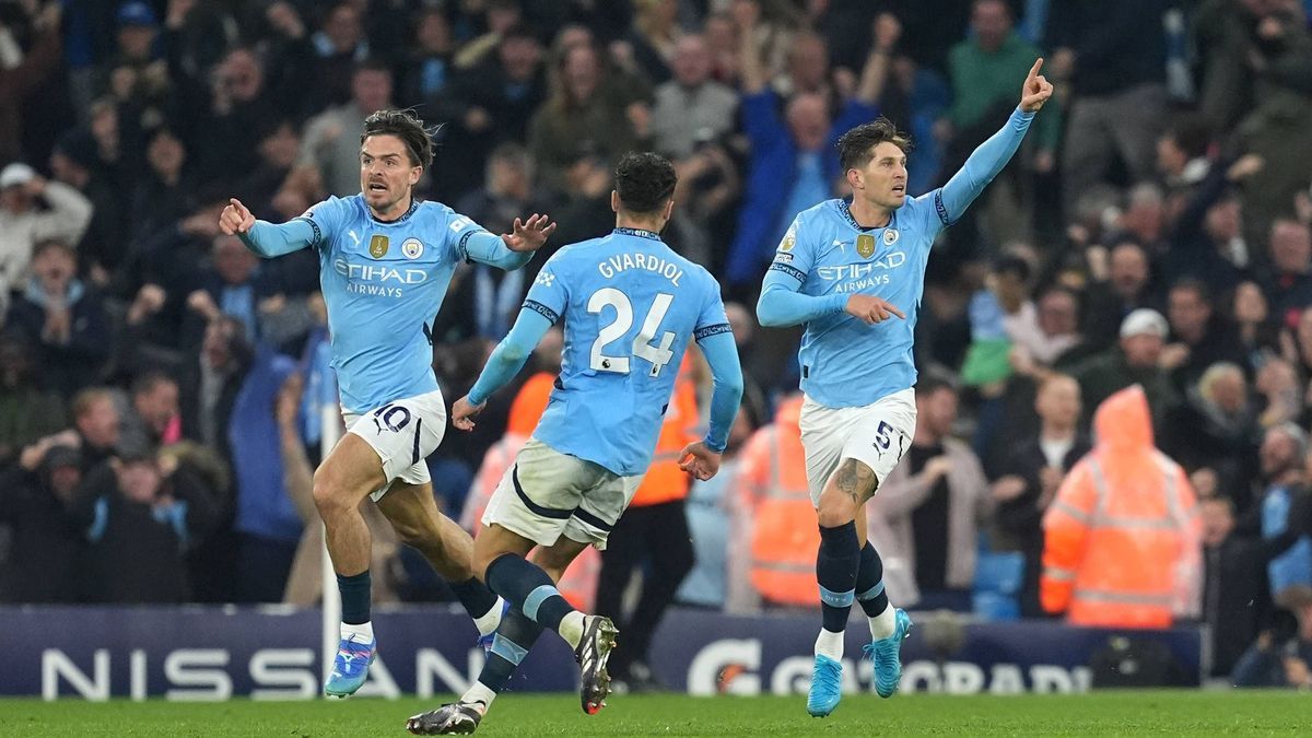 Manchester City v Arsenal - Premier League - Etihad Stadium Manchester City s John Stones (right) celebrates scoring their side s second goal of the game during the Premier League match at the Etih...