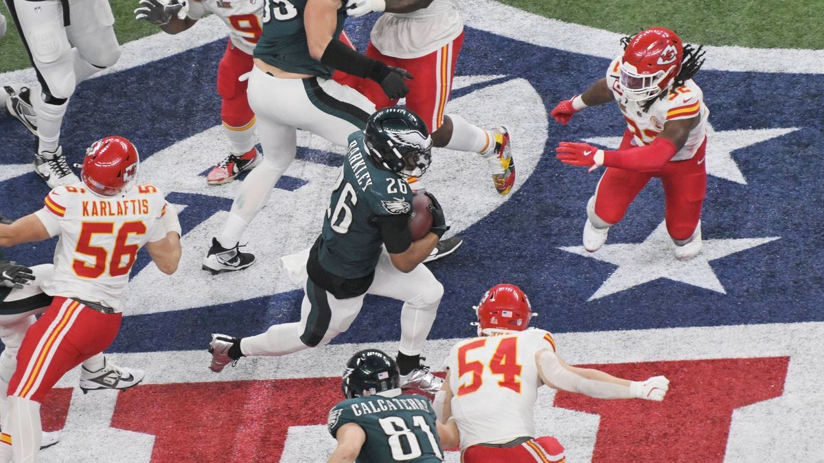 Philadelphia Eagles running back Saquon Barkley (26) rushes up the middle against the Kansas City Chiefs in the third quarter of Super Bowl LIX at Caesars Superdome in New Orleans on Sunday, Februa...