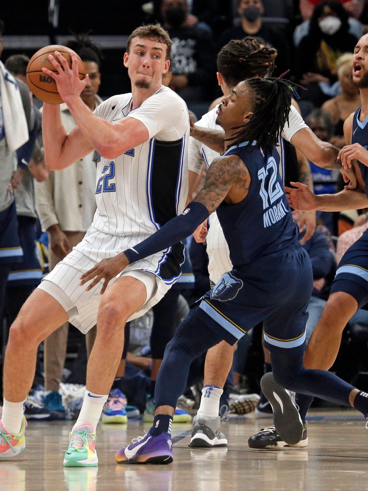 NBA, Basketball Herren, USA Orlando Magic at Memphis Grizzlies, Mar 5, 2022; Memphis, Tennessee, USA; Orlando Magic forward Franz Wagner (22) controls the ball against Memphis Grizzles guard Ja Mor...