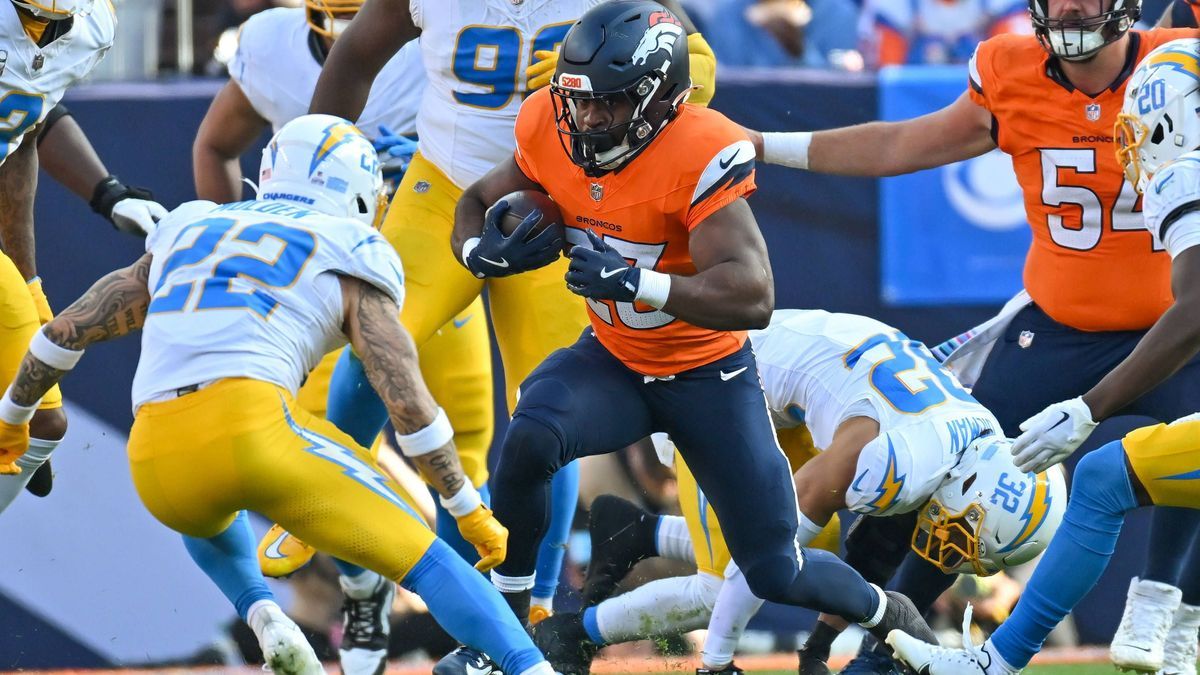 DENVER, CO - OCTOBER 13: Broncos running back Audric Estime (23) runs the ball during a game between the Denver Broncos and the Los Angeles Chargers at Empower Field at Mile High in Denver, CO on O...