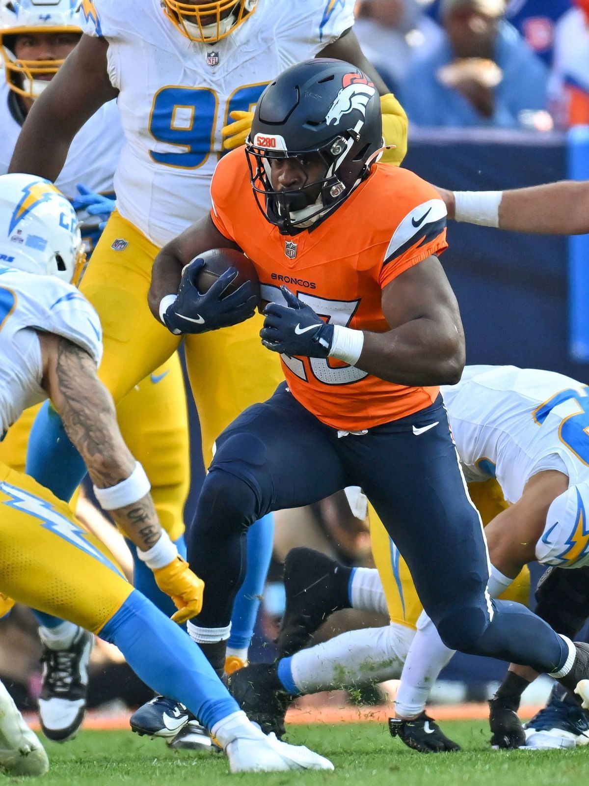 DENVER, CO - OCTOBER 13: Broncos running back Audric Estime (23) runs the ball during a game between the Denver Broncos and the Los Angeles Chargers at Empower Field at Mile High in Denver, CO on O...