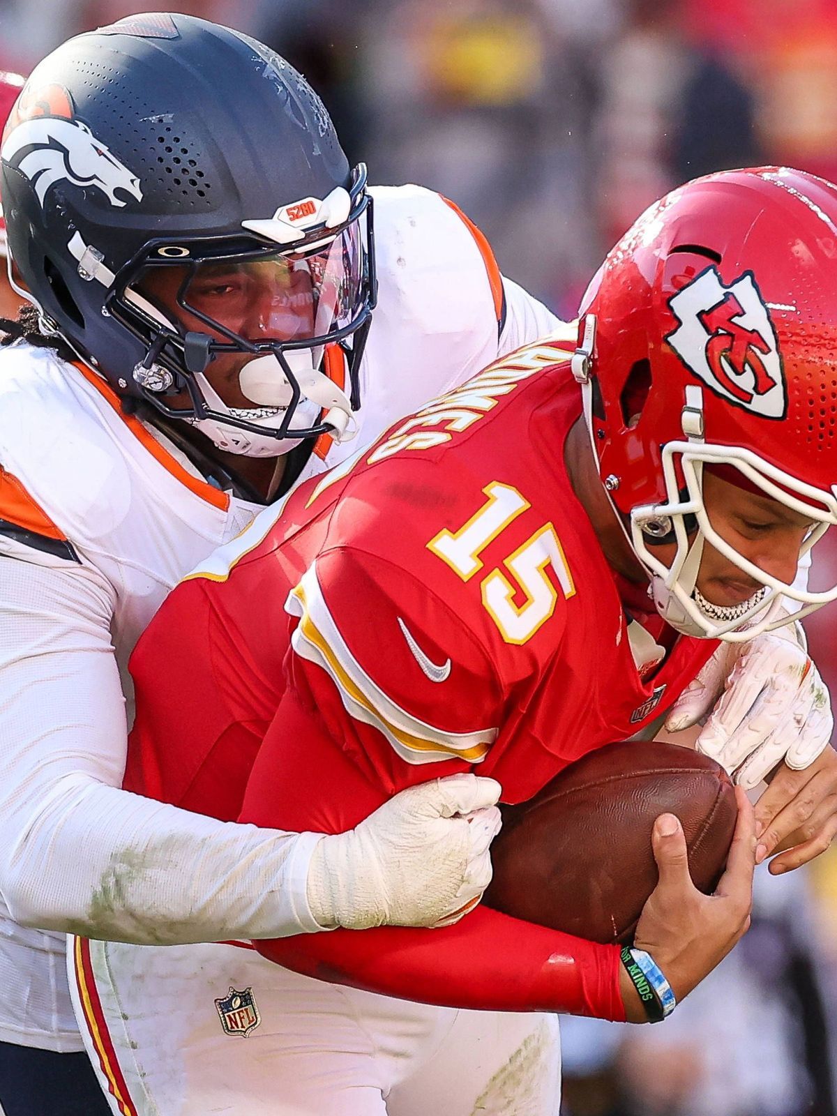 November 10, 2024: Kansas City Chiefs quarterback Patrick Mahomes (15) is sacked by Denver Broncos linebacker Nik Bonitto (15) during the second half at GEHA Field at Arrowhead Stadium in Kansas Ci...