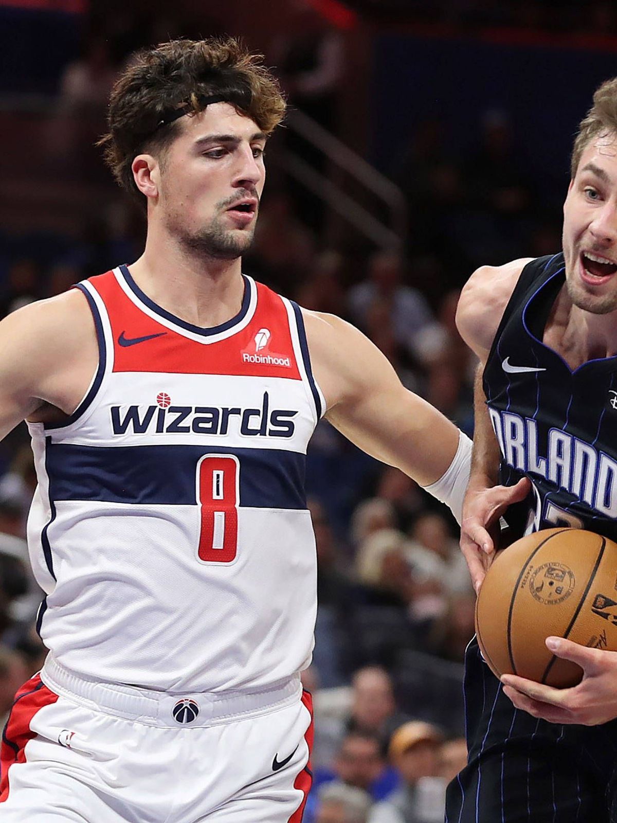 November 29, 2023, Orlando, FL - Florida, USA: The Orlando Magic s Franz Wagner, right, drives against the Washington Wizards Deni Avdija (8) at the Amway Center on Wednesday, Nov. 29, 2023, in Orl...