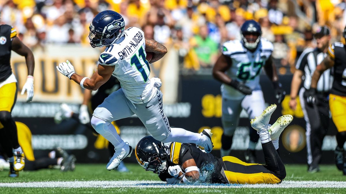 September 14, 2025, Pittsburgh, Pennsylvania, USA: Seattle Seahawks wide receiver JAXON SMITH NJIGBA (11) is tripped up by Pittsburgh Steelers safety JUAN THORNHILL (22) during the NFL, American Fo...