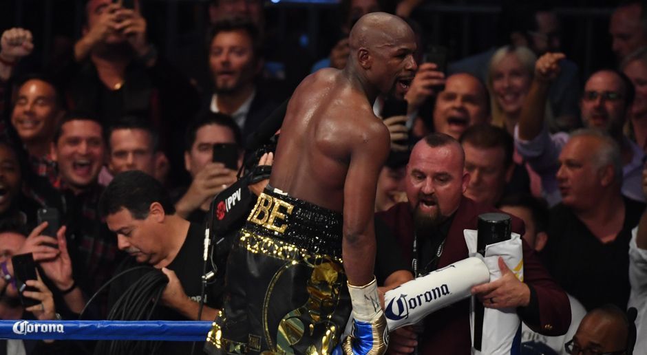 
                <strong>Floyd Mayweather siegt</strong><br>
                Der erwartete Sieger lässt sich im Bad der Menge feiern. Floyd Mayweathers beeindruckende Profiboxer-Bilanz: 50-0!
              