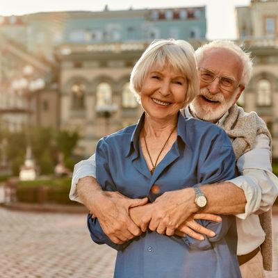 Love has no age limit. Happy senior couple in casual clothing embracing each other and smiling while standing outdoors