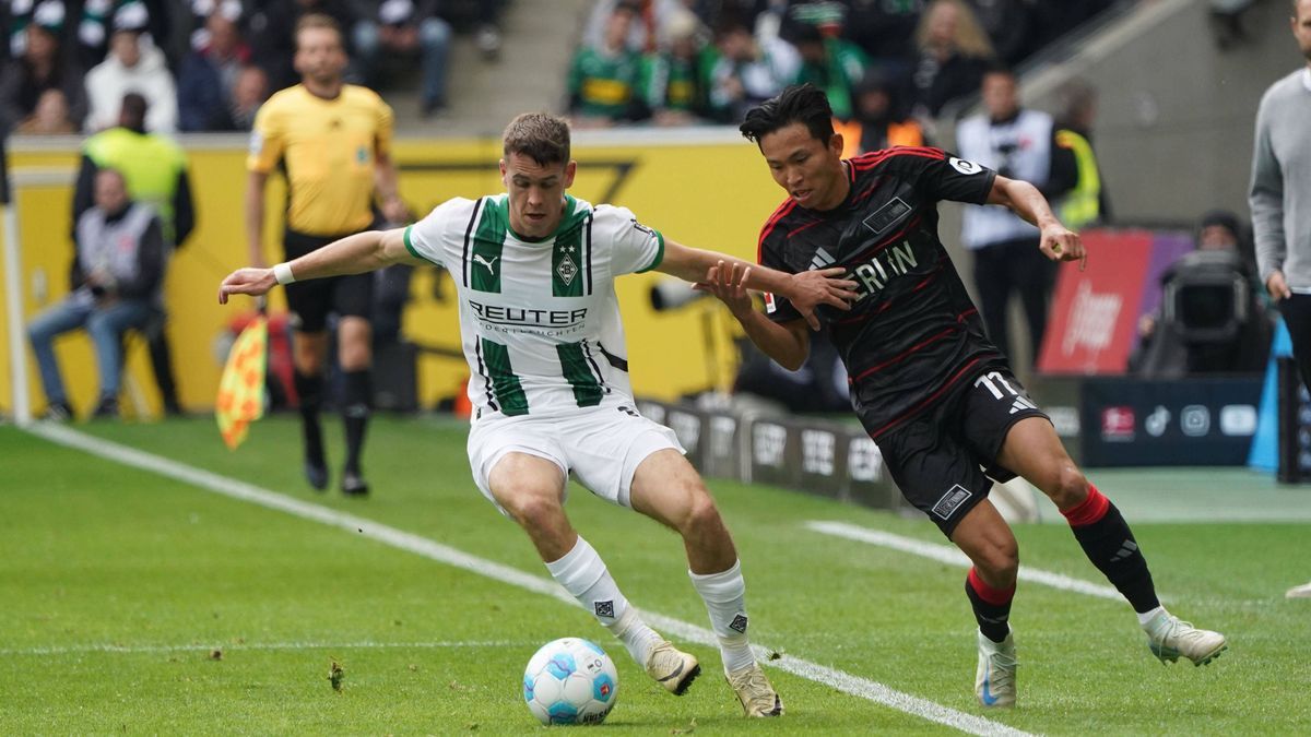 Fussball, 1.BL Saison 2024 2025 Borussia Mönchengladbach vs 1.FC Union Berlin , 28.09.2024, Stadion im Borussia Park Mönchengladbach, Philipp Sander, Jeong Wooyeong, 1.FC Union Berlin, *** Soccer, ...