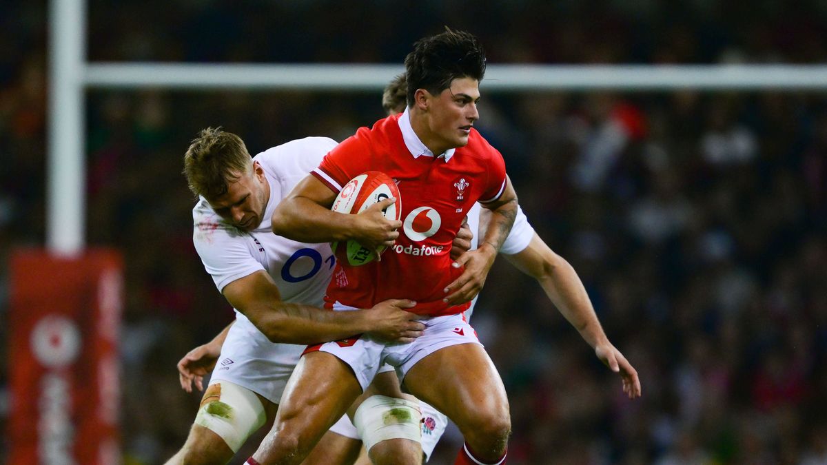 Wales v England, Twickenham, UK - 5 Aug 2023 Louis Rees-Zammit of Wales is tackled by Alex Dombrandt of England during the Summer Nations Series Rugby match between Wales and England at Principalit...