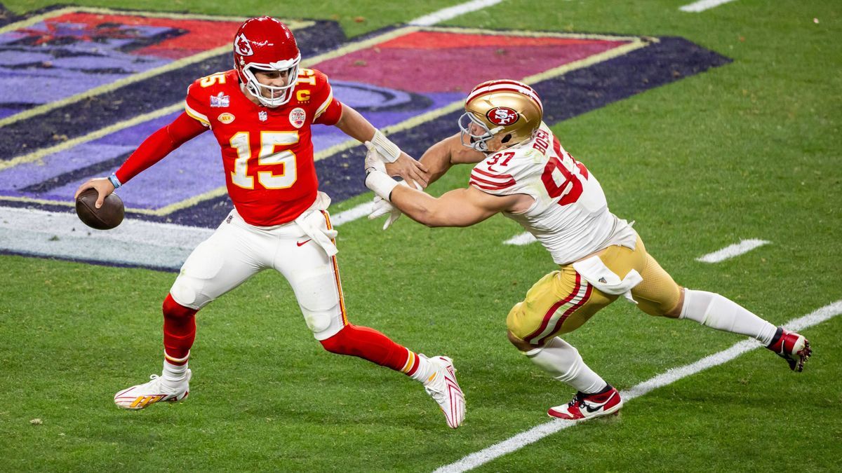 LAS VEGAS, NV - FEBRUARY 11: Kansas City Chiefs quarterback Patrick Mahomes (15) sheds off the sack attempt of San Francisco 49ers defensive end Nick Bosa (97) during Super Bowl LVIII between the K...
