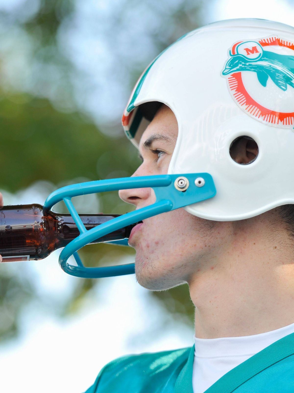 Mandatory Credit: Photo by Joe Toth BPI Shutterstock (5212756i) A Miami Dolphins fan tries to drink a beer through his helmet during the NFL, American Football Herren, USA Week 4 game between Miami...
