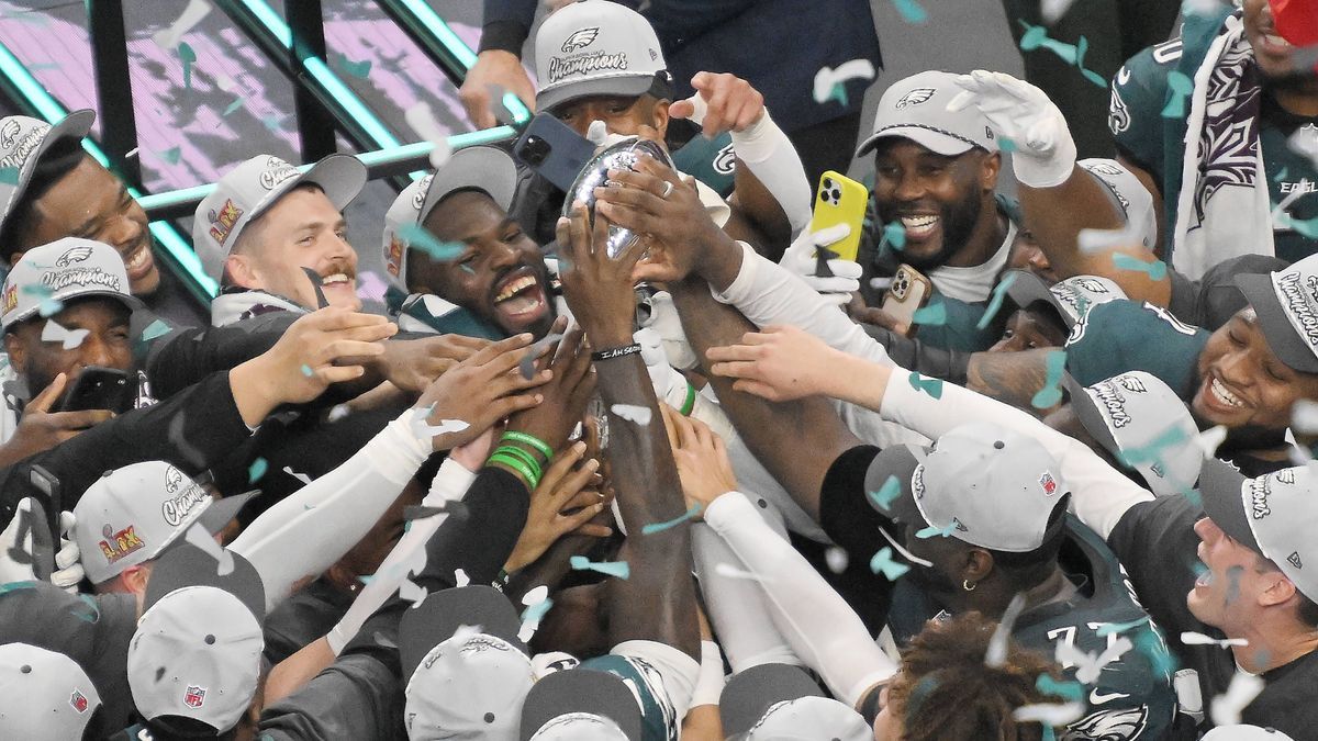 Philadelphia Eagles players hold the Vince Lombardy Trophy after defeating the Kansas City Chiefs 40-22 in Super Bowl LIX at Caesars Superdome in New Orleans on Sunday, February 9, 2025. PUBLICATIO...