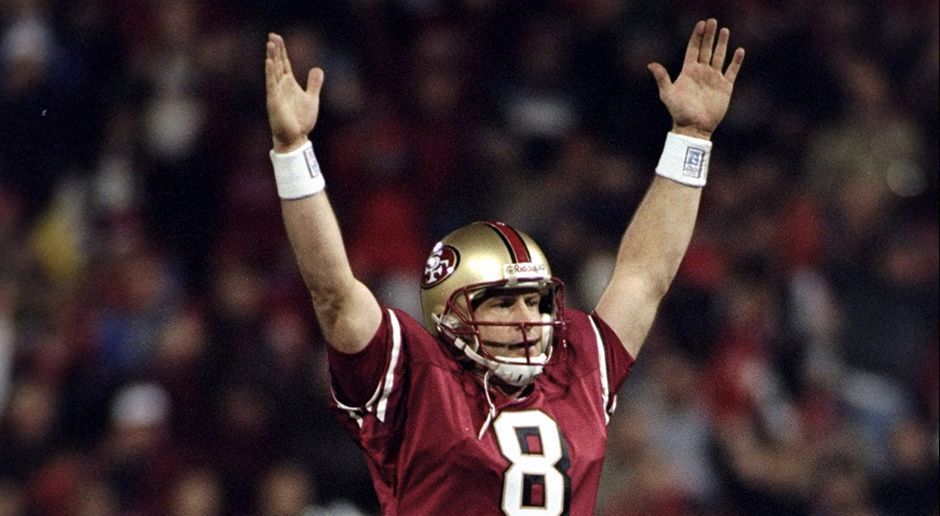 
                <strong>Steve Young</strong><br>
                Platz 2: Steve Young, 43 Rushing-Touchdowns (Teams: Tampa Bay Buccaneers, San Francisco 49ers) - Wie beerbt man einen erfolgreichen Quarterback wie Joe Montana? Ganz einfach: Man spielt wie Steve Young. Einmal gewann der Quarterback mit den San Francisco 49ers den Super Bowl und wurde 1992 und 1994 zum Liga-MVP gewählt.
              