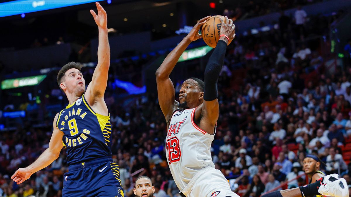NBA, Basketball Herren, USA Indiana Pacers at Miami Heat Feb 8, 2023; Miami, Florida, USA; Miami Heat center Bam Adebayo (13) grabs a rebound during the fourth quarter against Indiana Pacers guard ...