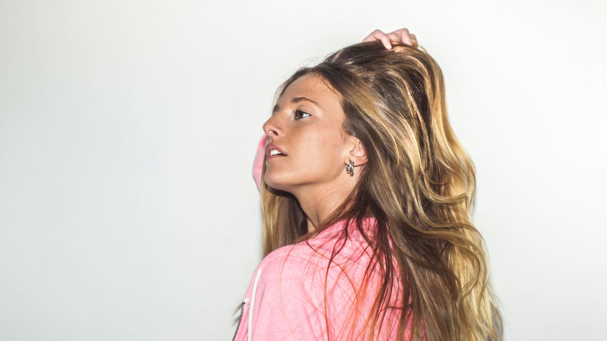 Close up portrait beautiful woman with pink sweatshirt shoot in studio