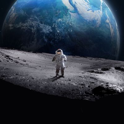 Astronaut on surface of the Moon. Earth on background. Apollo space program. Exploration of Moon. Dark crater. Elements of this image furnished by NASA