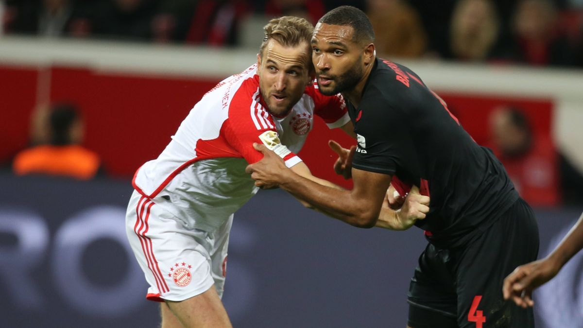 February 10, 2024, Leverkusen, Germany: Jonathan Tah of Leverkusen (R), fights for the ball against Harry Kane of Bayern Munich during the Bundesliga match between Leverkusen and Bayern Munich at B...