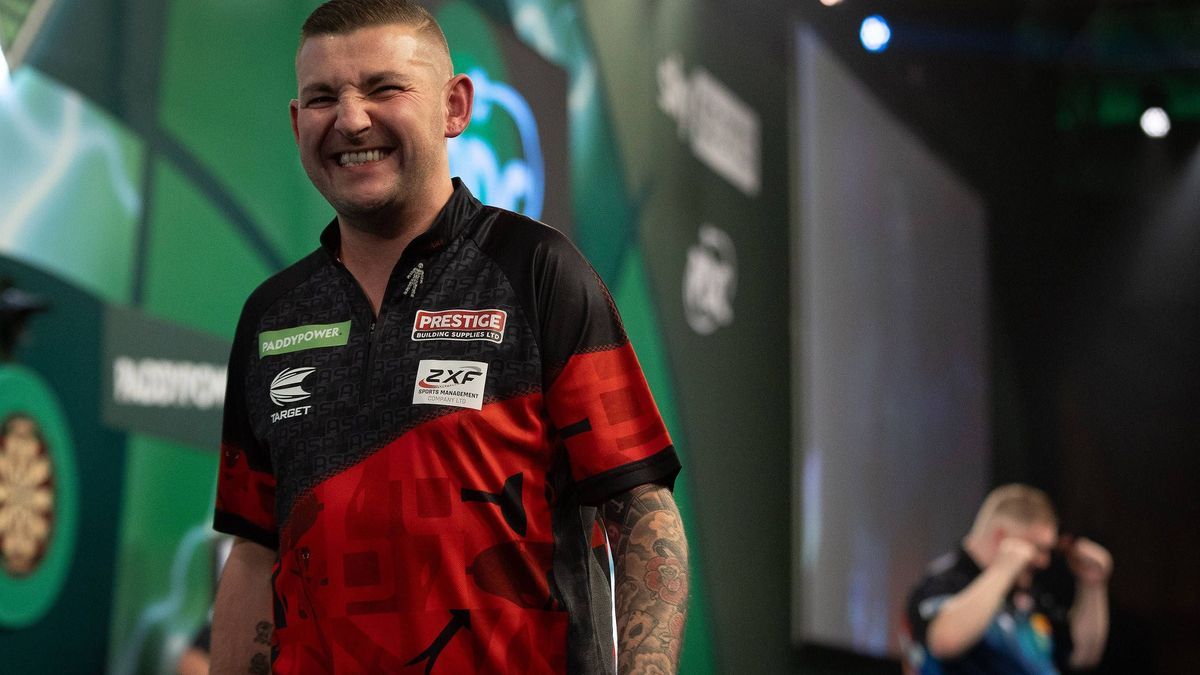 Darts Paddy Power 2024 PDC World Darts Championship Ricky Evans (ENG) celebrates winning his R2 match as Nathan Aspinall (ENG) walks off stage, during the 2024 PDC World Darts Championship at Alexa...