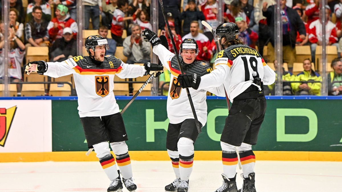 ODENSE, DENMARK - MAY 17: Wojciech Stachowiak of Germany R) celebrate his goal with Tim Stutzle of Germany C) and Marc Michaelis of Germany L) during the 2025 Ice hockey, Eishockey World Championsh...