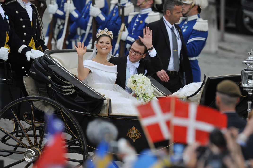 The newly wed Crown Princess Couple, Crown Princess Victoria of Sweden and Prince Daniel of Sweden ride in a royal carriage through the city of Stockholm