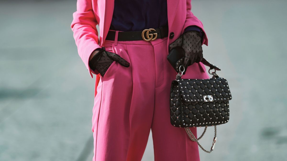 Paris, France - February 29, 2020: Black studded handbag and Gucci belt detail - streetstylefw20