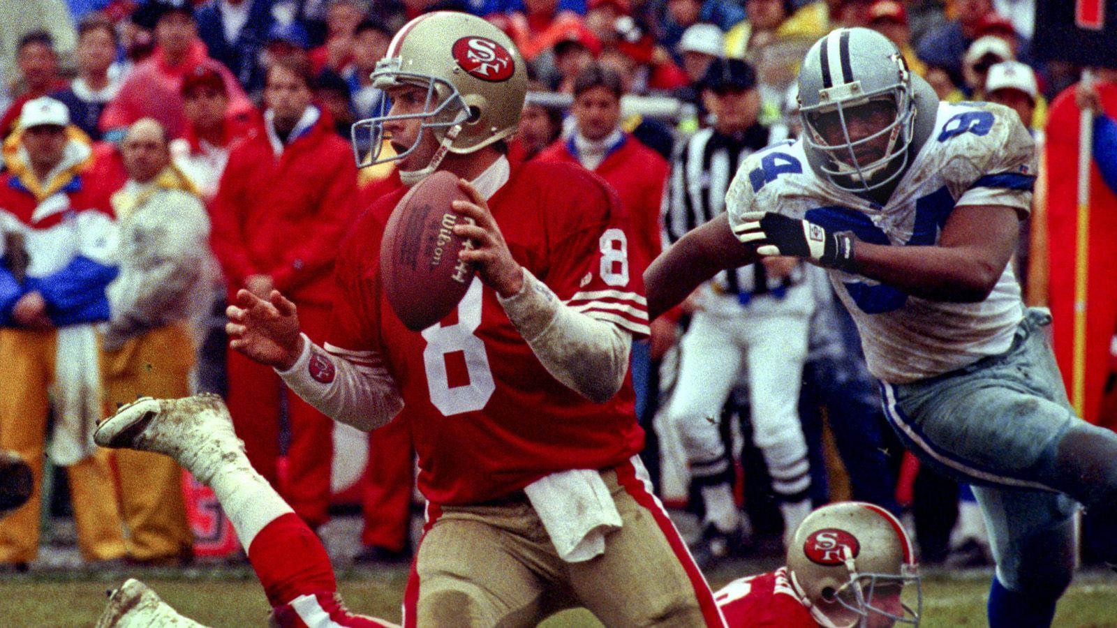 
                <strong>Joe Montanas Fackelübergabe</strong><br>
                1990 gewannen die Niners mit 24:6 gegen die Cowboys. Es sollte das letzte Spiel von Joe Montana gegen die Cowboys werden und das erste von Troy Aikman gegen die 49ers. Auf Montana folgte bei den 49ers Steve Young, der selber als Starter 1994 seinen ersten Super Bowl gewinnen sollte. Und natürlich zuvor im Championship Game die Dallas Cowboys (38:28) aus den Playoffs warf.
              