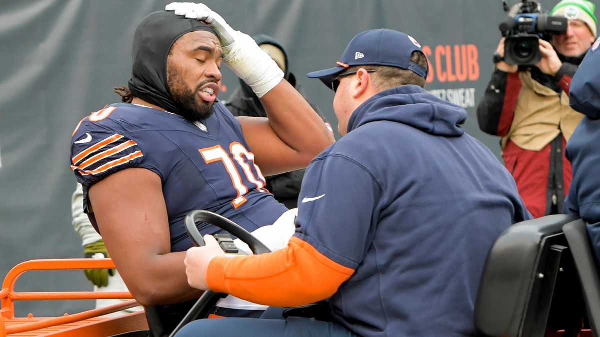 Chicago Bears offensive tackle Braxton Jones (70) is carted off the field during a game against the Detroit Lions at Soldier Field in Chicago on Sunday, December 22, 2024. Lions defeated the Bears ...