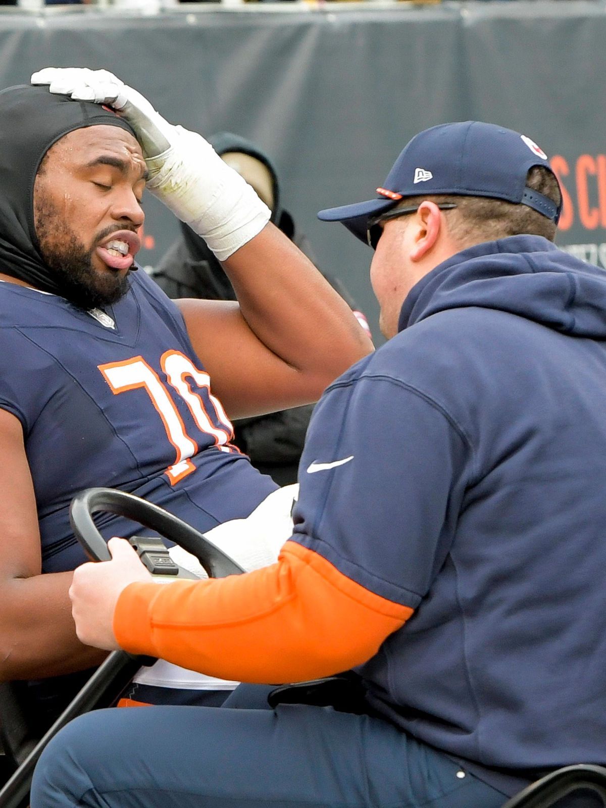 Chicago Bears offensive tackle Braxton Jones (70) is carted off the field during a game against the Detroit Lions at Soldier Field in Chicago on Sunday, December 22, 2024. Lions defeated the Bears ...