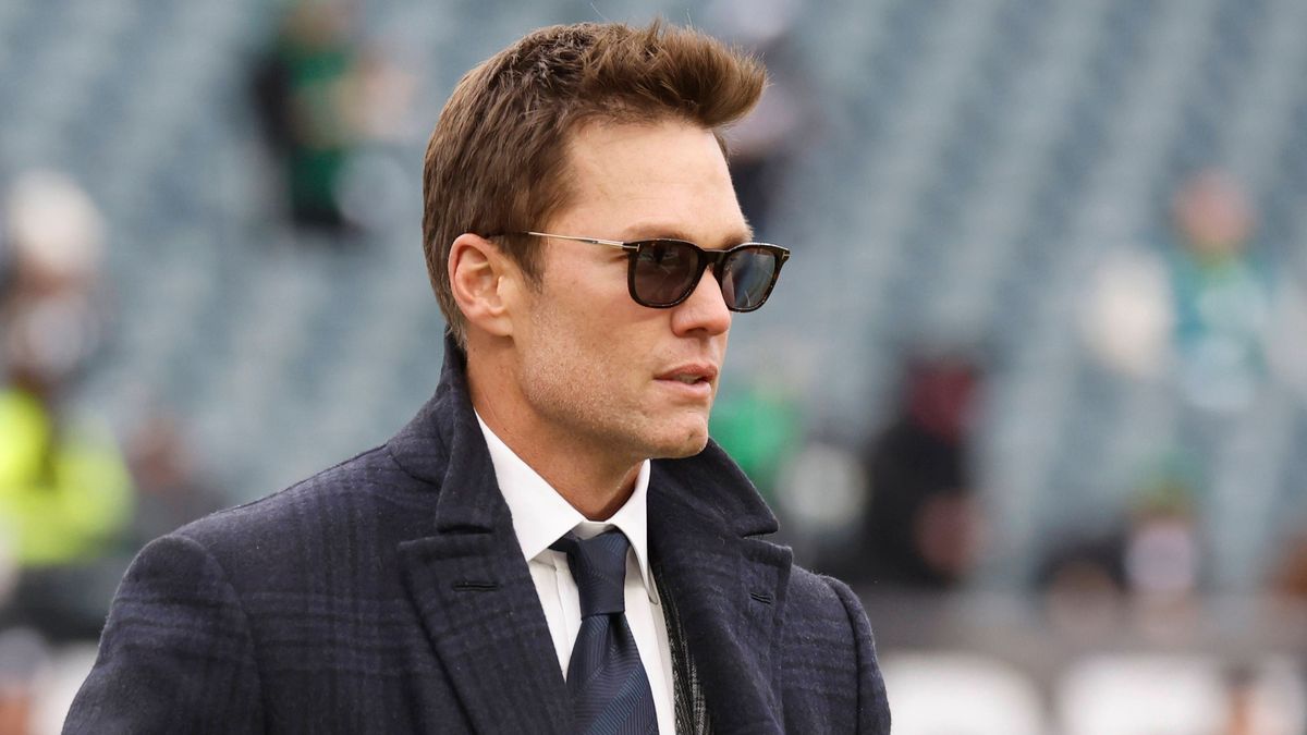 Tom Brady walks on the field before delivering television commentary for the NFC Championship Game between the Philadelphia Eagles and the Washington Commanders at Lincoln Financial Field in Philad...