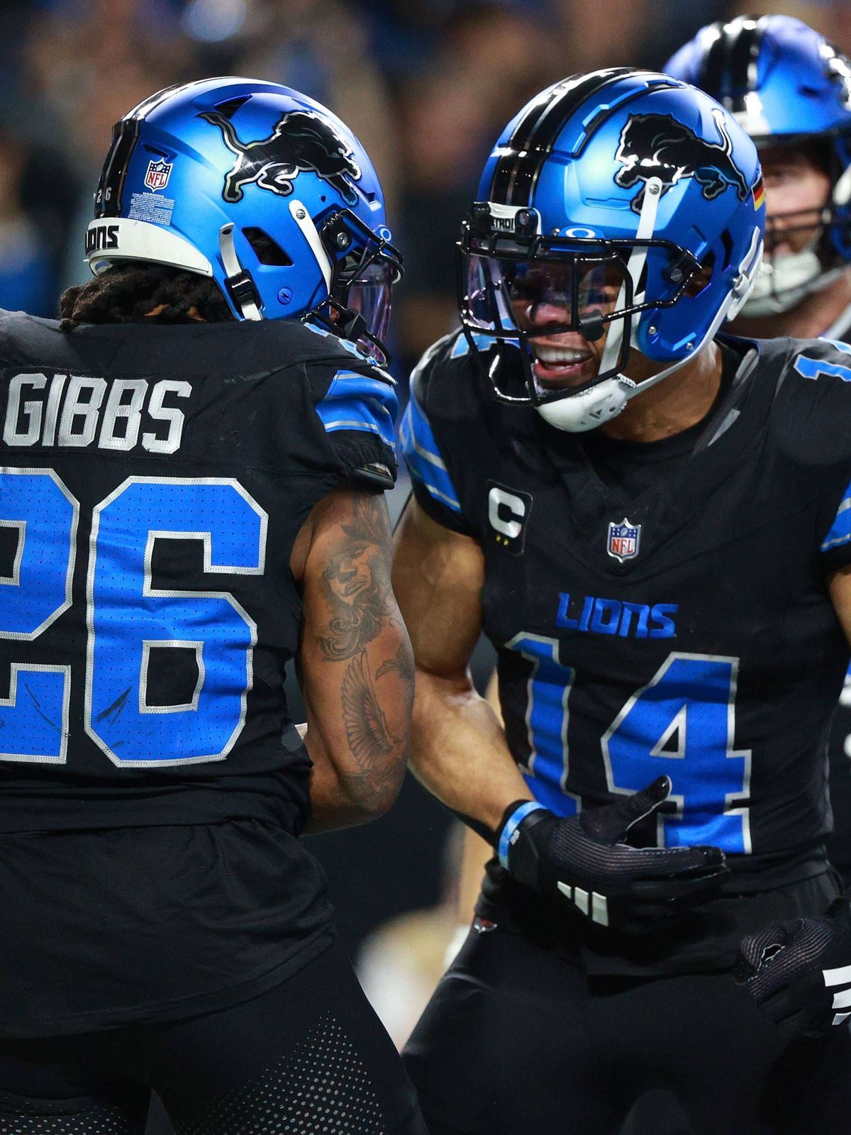 Minnesota Vikings vs Detroit Lions DETROIT,MICHIGAN-January 5: Detroit Lions running back Jahmyr Gibbs 26 celebrates with teammate wide receiver Amon-Ra St. Brown 14 after his touchdown during the ...