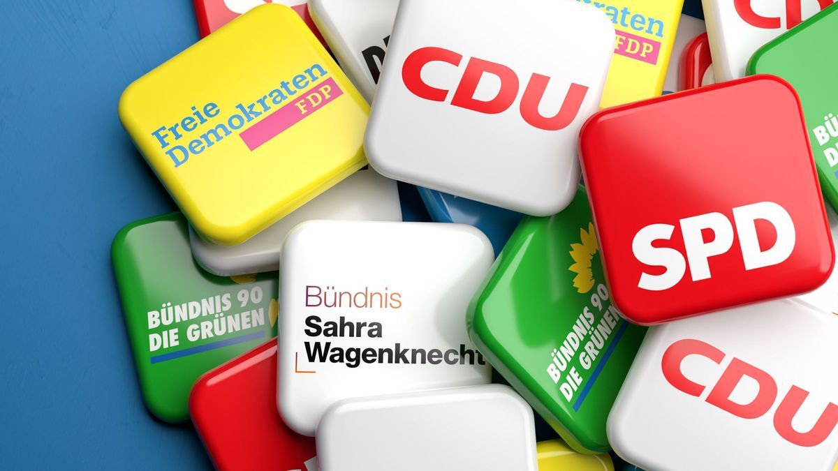 Logos of the biggest German nationwide operating political parties (CDU, SPD, Die Grünen, FDP, Die Linke, BSW, AfD) on a heap on a table.