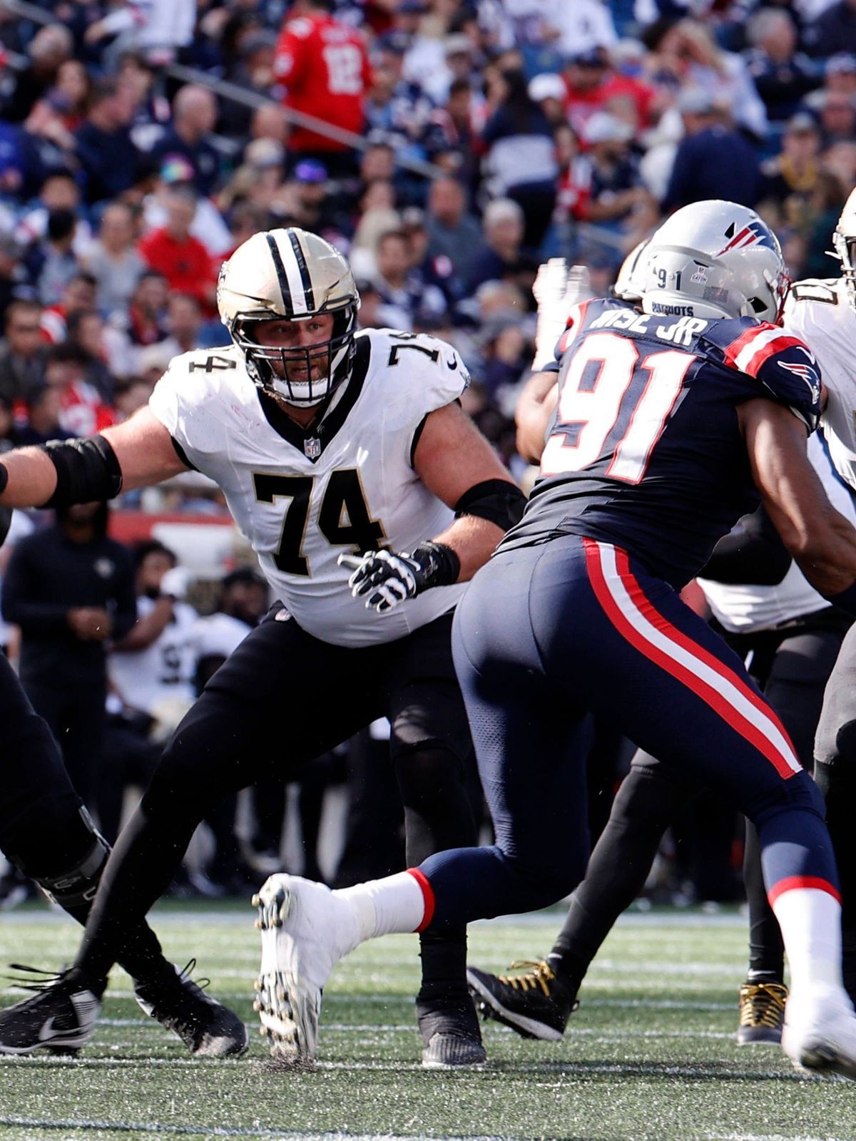 FOXBOROUGH, MA - OCTOBER 08: New Orleans Saints offensive Guard James Hurst (74) and New Orleans Saints offensive tackle Trevor Penning (70) hold the line during a game between the New England Patr...