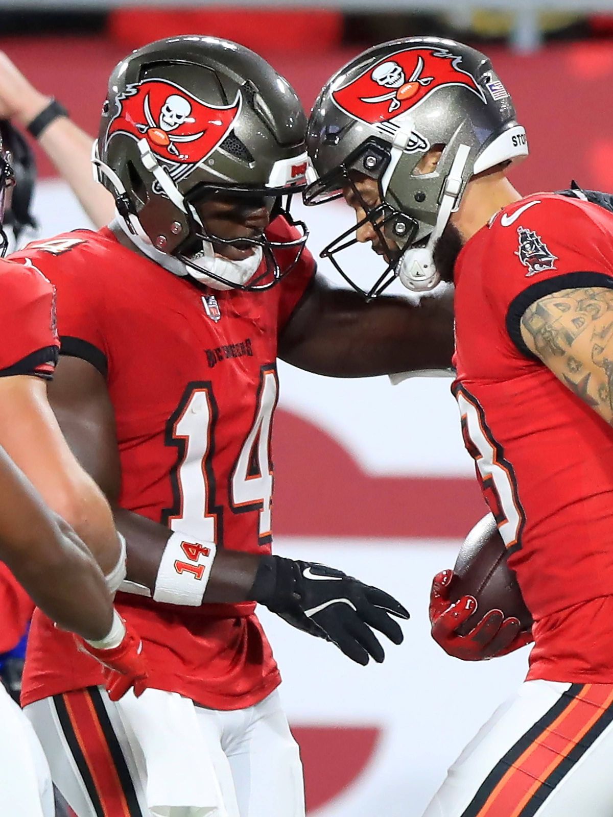 TAMPA, FL - OCTOBER 21: Tampa Bay Buccaneers Wide Receiver Chris Godwin (14) reacts to Wide Receiver Mike Evans (13) who caught a touchdown but appeared to have strained his hamstring on the play e...